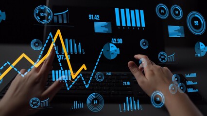 Dynamic scene featuring hands on a keyboard engaged in data analysis, surrounded by vibrant charts and graphs, illustrating the intersection of technology and finance. Xenic