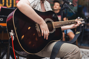 Acoustic guitar performance at live music concert