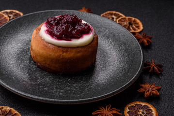 Cinnamon roll, a sweet bun with citrus, cherries, and chocolate, a Danish dessert with cream