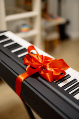 Digital Piano Gift with Red Ribbon