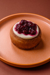 Cinnamon roll, a sweet bun with citrus, cherries, and chocolate, a Danish dessert with cream