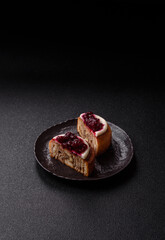 Cinnamon roll, a sweet bun with citrus, cherries, and chocolate, a Danish dessert with cream