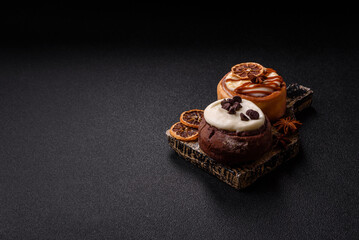 Cinnamon roll, a sweet bun with citrus, cherries, and chocolate, a Danish dessert with cream