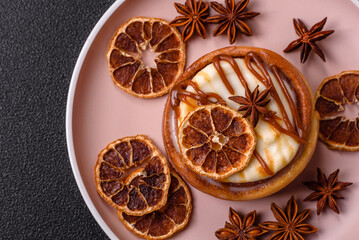 Cinnamon roll, a sweet bun with citrus, cherries, and chocolate, a Danish dessert with cream