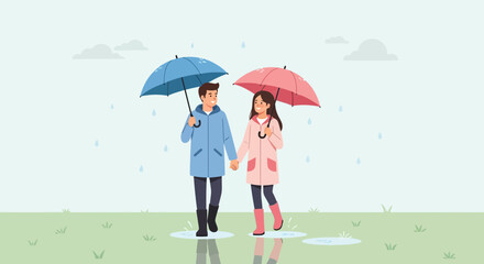 Romantic couple walking in the rain holding hands and umbrellas together outdoors
