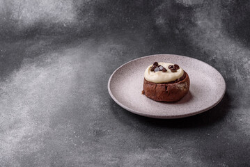 Cinnamon roll, a sweet bun with citrus, cherries, and chocolate, a Danish dessert with cream