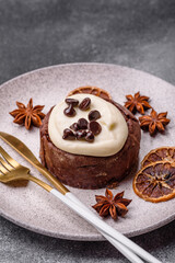 Cinnamon roll, a sweet bun with citrus, cherries, and chocolate, a Danish dessert with cream