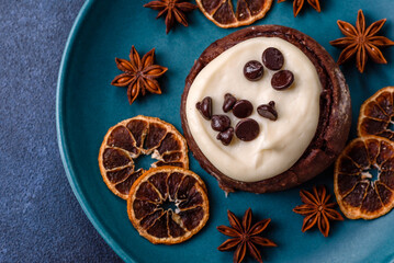 Cinnamon roll, a sweet bun with citrus, cherries, and chocolate, a Danish dessert with cream