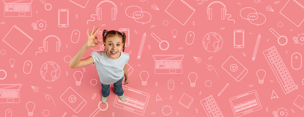 A happy child stands confidently in a school environment, making an okay sign. The bright pink background features drawings of school supplies, highlighting creativity and learning.