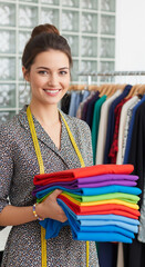 female dressmaker working with fabrics