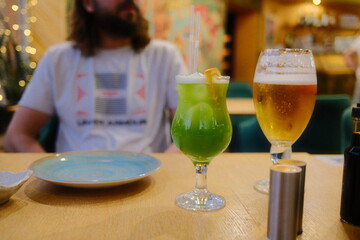 Drinks on table, someone waits.