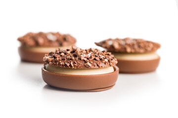 Sweet chocolate pralines. Chocolate candies isolated on white background.
