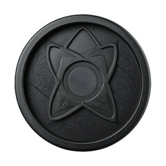 A dark, circular object with a textured surface features an intricate design consisting of a central circle and radiating shapes, rendered in a solid black color against a plain black background,...