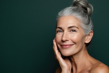 Radiant mature woman with silver hair smiling portrait for wellness beauty and age confidence