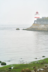 Brockton Point Fog and Mist. Fog over Burrard Inlet and the Brockton Point Lighthouse. Stanley Park, Vancouver.
