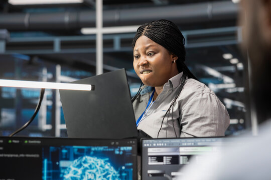 IT specialist raging after finding errors while inspecting neural network data center used for machine learning. Upset engineer angered by glitches found during maintenance on server hub