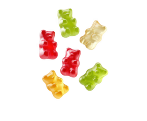 A colorful assortment of gummy bear candies, including red, yellow, green, and white, scattered and isolated on a pure transparent background, evoking a sense of sweetness and childhood nostalgia
