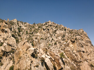 Rocky Mountain Cliff Under Clear Blue Sky