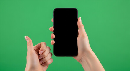 Hands holding smartphone with blank screen and thumbs up gesture, perfect for app mockups and digital content