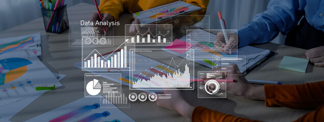 A diverse team collaborates on data analysis, utilizing colorful charts and graphs to enhance...