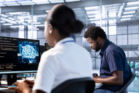 Server hub workspace IT professional using AI systems to input data faster and solve complex computational tasks. Data center worker using artificial intelligence parallel processing technology