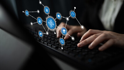 A business professional engages with technology by typing on a keyboard, showcasing a digital network connection that symbolizes modern communication in the workplace. Tessel