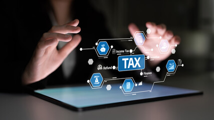 Dynamic visual of hands interacting with a digital interface focused on tax concepts, symbolizing...