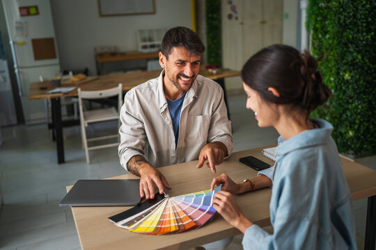 Designers collaborating on color palette for interior project