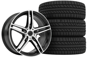 Car alloy wheel and stack of tires isolated on transparent background