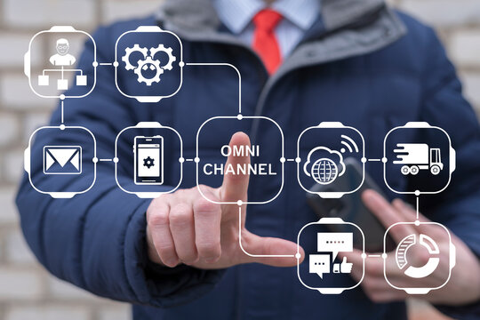 Business person using virtual touchscreen presses the text OMNI-CHANNEL. Omnichannel Business Marketing Customer Concept. Omni Channel Database Service Information Technology.