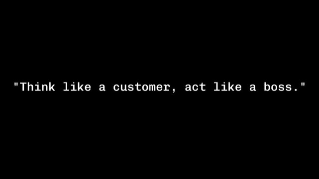 A motivational quote on a black background says think like a customer act like a boss