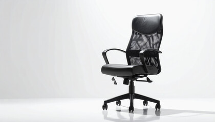 Fototapeta premium Sleek black office chair positioned centrally on a minimal white background with ample copy space for text usage