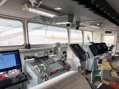 navigation bridge of the cargo ship. nautical equipment and charts 22