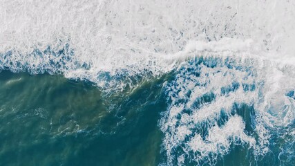 Sea Waves Crash in Sicily During the Italian Winter Vertical Overhead - Powered by Adobe