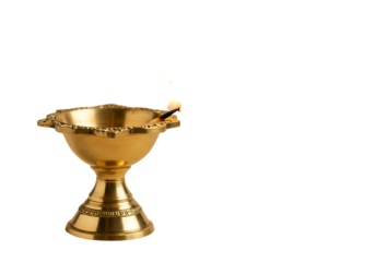 A lit diya lamp, a traditional oil lamp used in India.