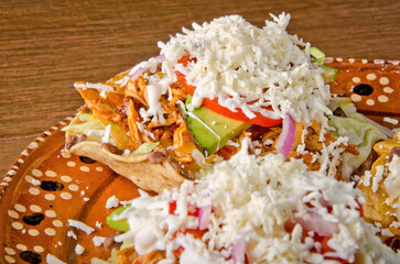 Authentic Mexican Chicken Tinga Tostadas with Cream and Fresh Cheese