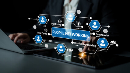 A business professional works on a laptop, illustrating the concept of people networking with focus on mentorship and community building through digital interactions. Tessel
