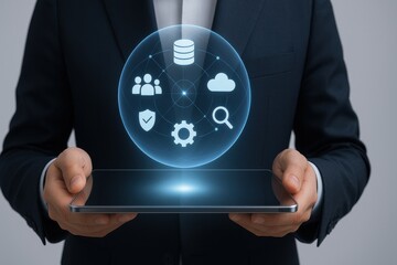 Businessman holding tablet with holographic sphere of cloud computing data security and analytics icons
