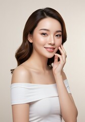A beautiful young Asian woman with smooth, clear skin and a gentle smile, showcasing a natural, healthy complexion