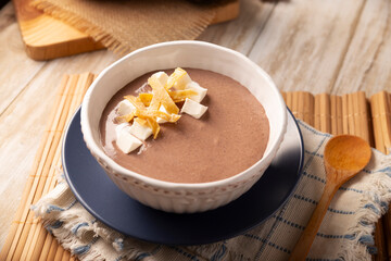 Creamy bean soup. In Mexico known as Crema de Frijoles, nutritious homemade food recipe, commonly accompanied with cheese, cream, avocado and corn tortilla cut into strips and fried.