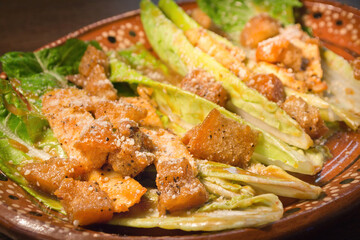 Gourmet Caesar Salad with Crispy Pork Belly and Parmesan Cheese