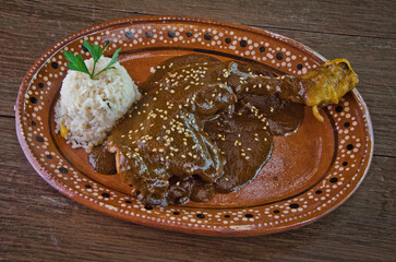 Traditional Mexican Chicken Mole Poblano with Rice and Sesame Seeds