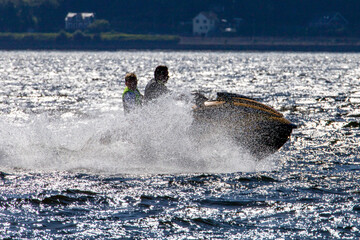 Obraz premium Jet Ski is name of a personal watercraft manufactured by Kawasaki, a Japanese company. Used to refer to any type of personal watercraft used for recreation, used as a verb to describe the use of PWC.