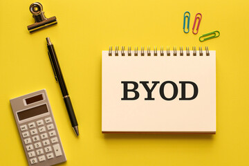 There is notebook with the word BYOD. It is an abbreviation for Bring Your Own Device as eye-catching image.