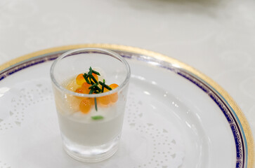Elegant gourmet appetizer with salmon roe served in a glass