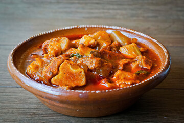 Hearty Mexican Pork and Vegetable Stew (Mole de Olla) in a Clay Bowl