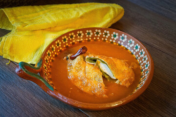 Authentic Mexican Chile Relleno Stuffed with Cheese in Tomato Broth