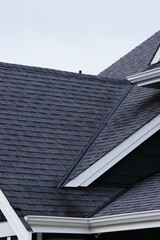 Dark asphalt roof shingles