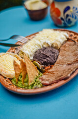 Traditional Mexican Almuerzo Platter with Steak, Enchiladas, and Guacamole