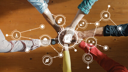 Collaborative Management Concept with Hands Over Digital Interface Representing Data Sharing and Connections in Business Environment. Amity